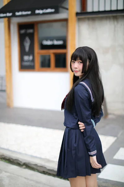 Portrait japanese school girl in downtown ice cream shop — Stock Photo, Image