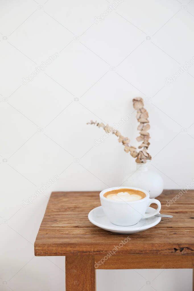 cappuccino or Latte art coffee made from milk on the wood table 