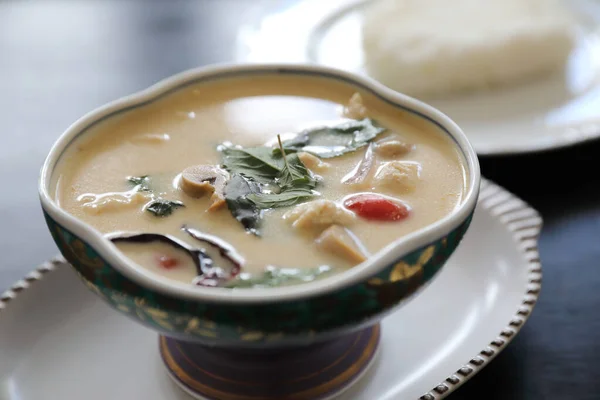 Coconut milk soup with chicken and rice , traditional Thai food