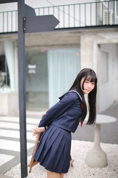 Portrait japanese school girl in downtown ice cream shop — Stock Photo, Image