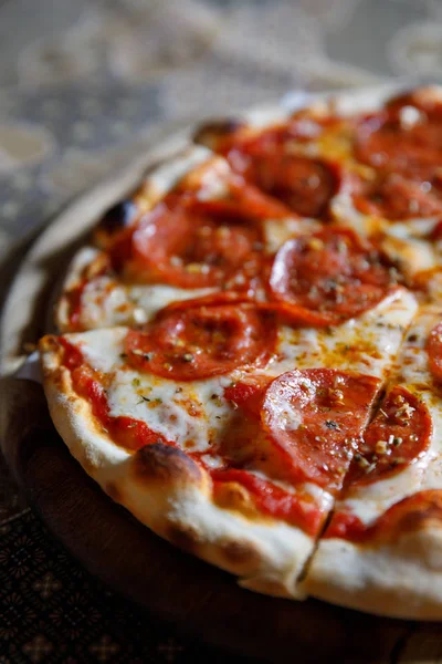 Pepperoni pizza on wood plate italian food — Stock Photo, Image