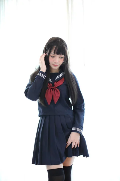 Portrait japanese school girl in white tone bed room — Stock Photo, Image