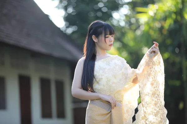 Portrait of Thai female with traditional Thai dress with temple — Stock Photo, Image