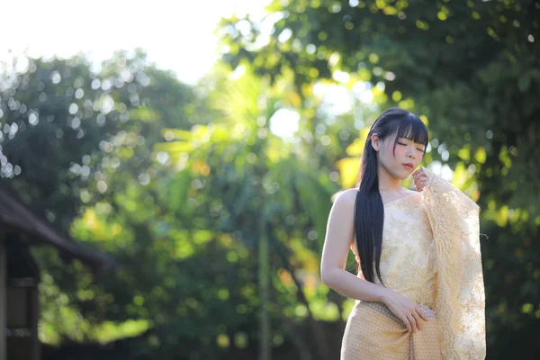 Portrait of Thai female with traditional Thai dress with temple — Stock Photo, Image