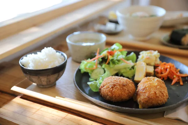 Beef Croquette with rice and salad japanese style Korokke on woo — Stock Photo, Image