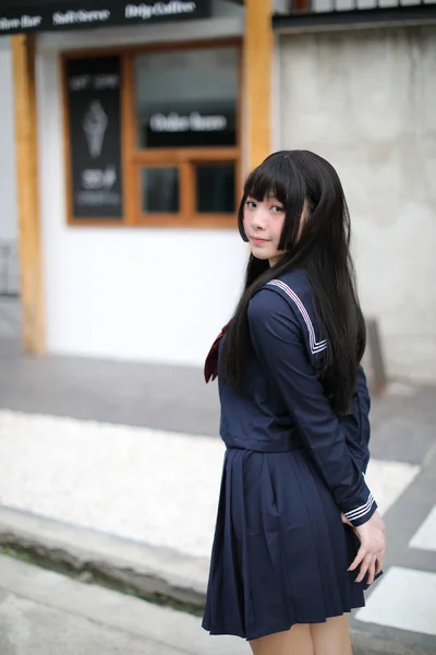 Portrait japanese school girl in downtown ice cream shop — Stock Photo, Image