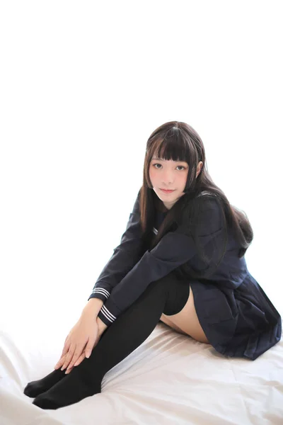 Portrait japanese school girl in white tone bed room — Stock Photo, Image