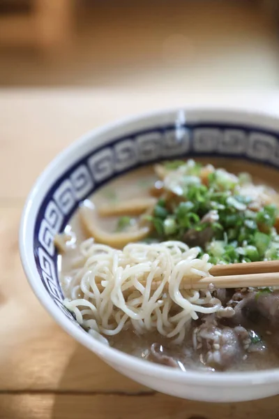 Ramen Japanese noodle soup food with noodle and pork on wooden table