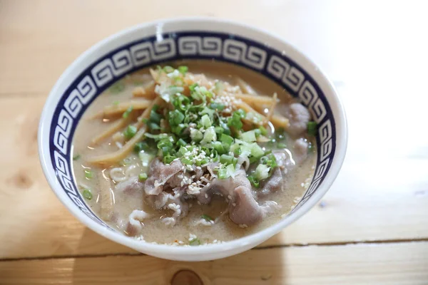 Ramen Japanese noodle soup food with noodle and pork on wooden table