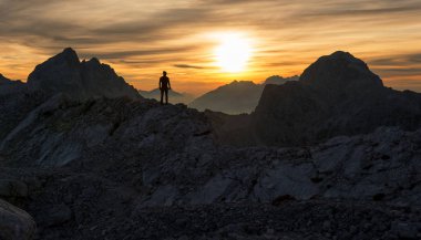 Male hiker at the top of the mountain  clipart