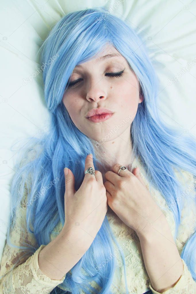 blue hair woman with closed eyes