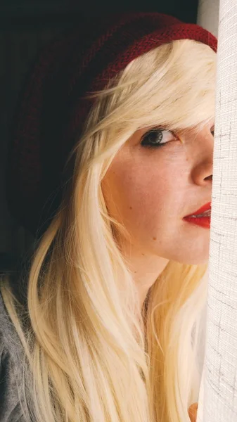 Portrait Young Blonde Woman Red Lips Hat Sweater Window — Stock Photo, Image