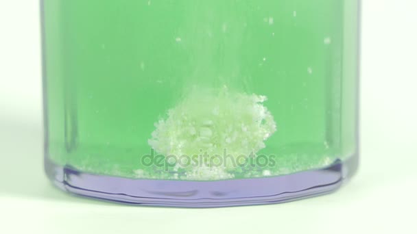 Effervescent tablet dissolving in water. — Stock Video