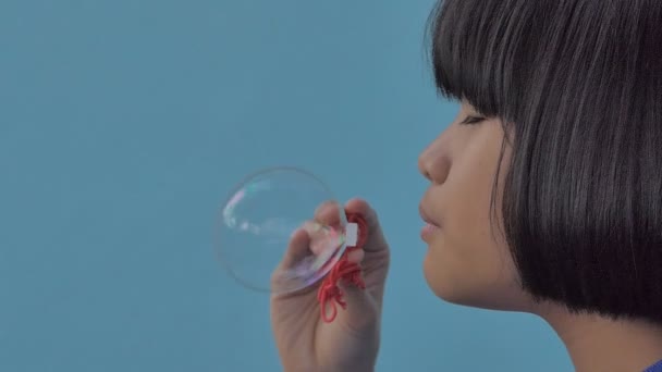 Asian Girl Blowing Soap Bubbles Slow Motion Happy Childhood Concept — Stock Video