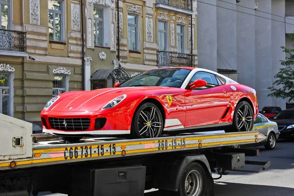 Kiev, Ukraine, July 13, 2015. Ferrari 599 Alonso Edition 60F1. Car on a tow truck. Editorial photo. Royalty Free Stock Photos