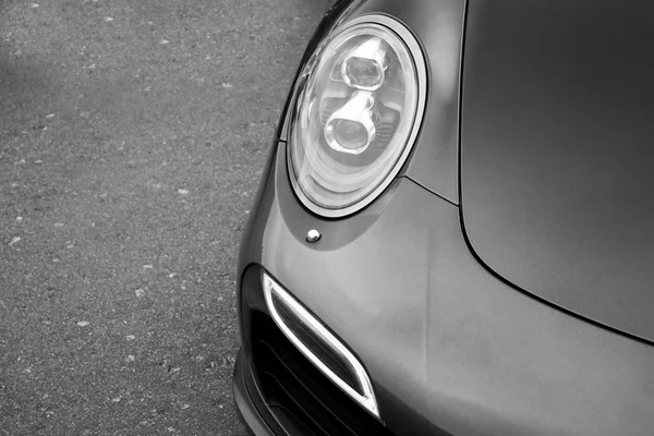 Car headlights. Luxury Headlights. Black and white photo — Stock Photo, Image