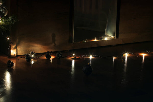 New Year's lights in the house. Festive lights in the dark