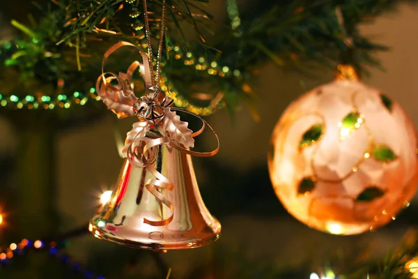 New Years toys on a New Year tree. Bell — Stock Photo, Image