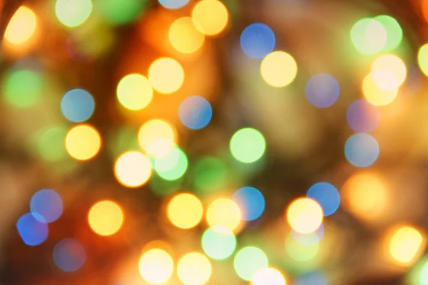 Blurred photo. Festive lights out of focus. Festive background — Stock Photo, Image