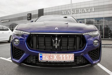 Kiev, Ukraine - April 21, 2020: A luxury Maserati Levante car parked in the city. Front view of the car clipart