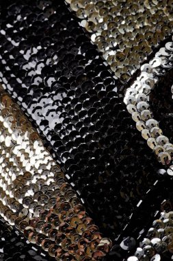 Parlak renklerin payetleri ve payetleri ile kumaş. Moda glitter kumaş, payetler. Parlak yüzey
