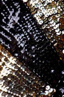 Parlak renklerin payetleri ve payetleri ile kumaş. Moda glitter kumaş, payetler. Parlak yüzey