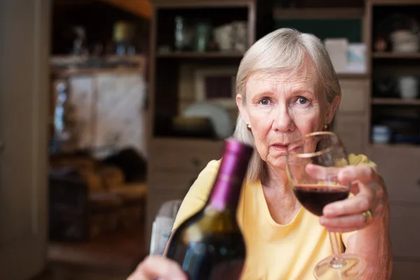 Lonely female alcoholic offering wine — Stock Photo, Image