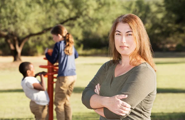 Confident single mother with children playing — Stock Photo, Image