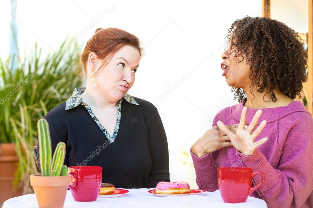 Doubtful woman listening to friend