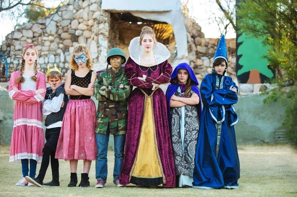 Seven theater students in front of stage — Stock Photo, Image