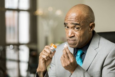 Worried man with an Opioid Prescription Pill clipart