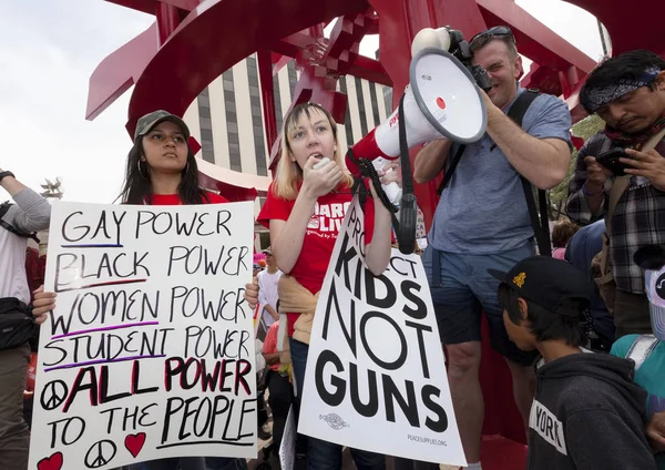 Young woman addressing crowd with megaphone at gun violence prot — Stock Photo, Image