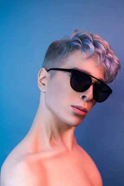 beauty portrait of young man with colored hair