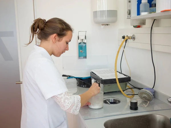 Female dental technician working in a dental lab