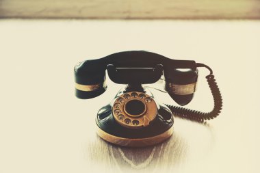 Vintage telephone on floor clipart