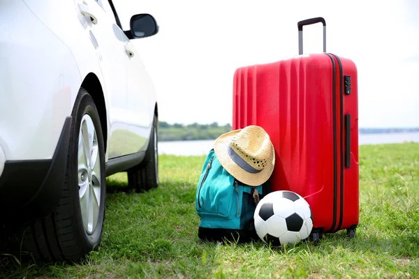 Luggage and accessories near car. Travel concept — Stock Photo, Image