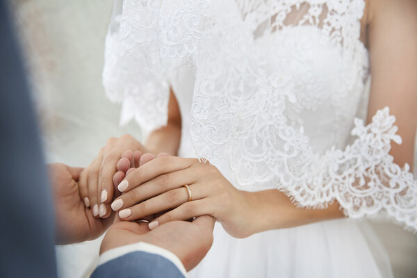 Bride and groom hands, closeup