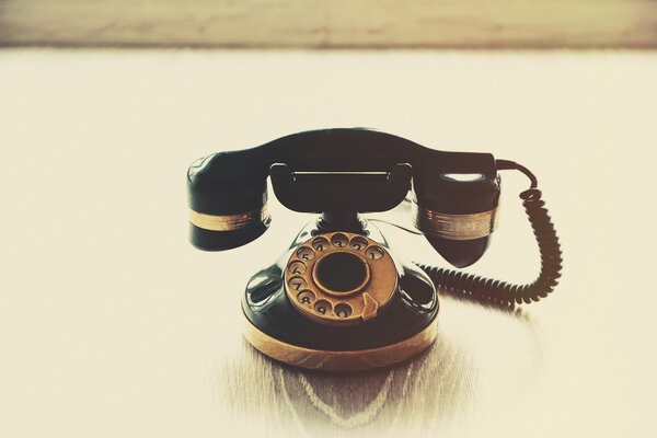 Vintage telephone on floor