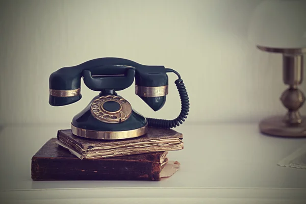 Vintage telephone on white table — Stock Photo, Image