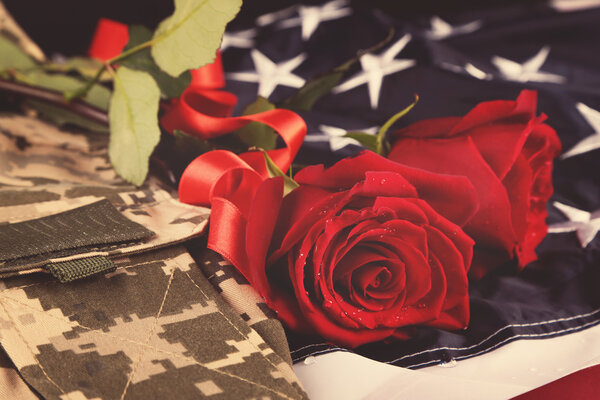 Red roses on American flag 