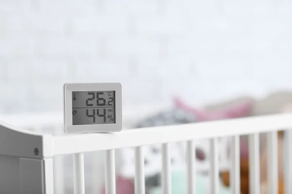 Digital temperature and humidity control on cot — Stock Image Digital temperature and humidity control on cot Royalty Free Stock Photos