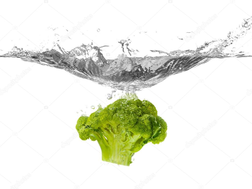 Broccoli falling into water 