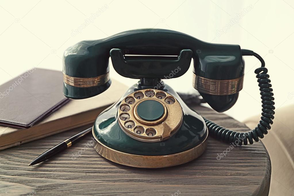 Vintage telephone on wooden table