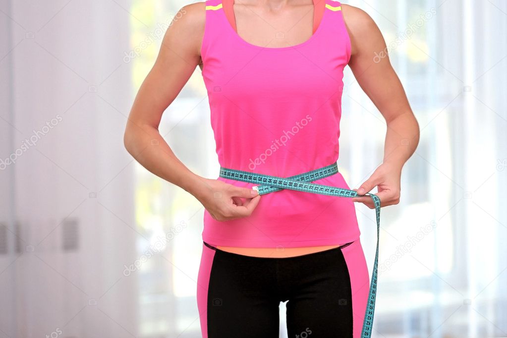  woman measuring waist