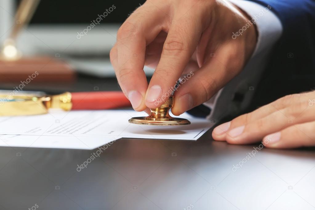 Notary public in office stamping document