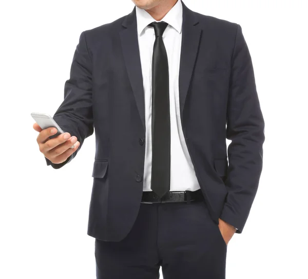 Businessman holding phone in hand on white background — ストック写真