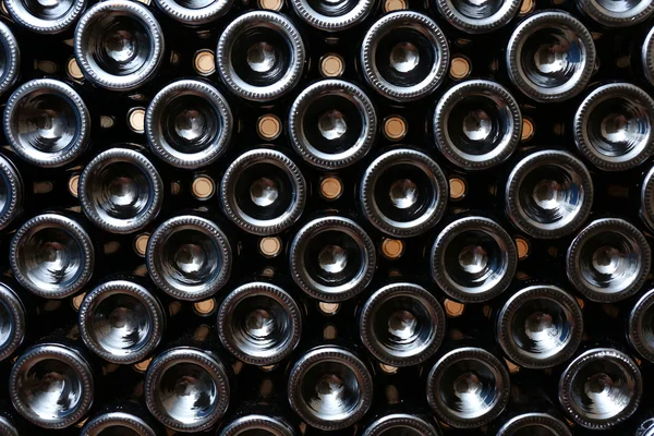 Many wine bottles in cellar — Stock Photo, Image