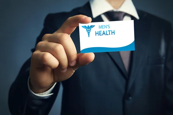 Businessman holding business card close up. Urology concept — Stock Photo, Image