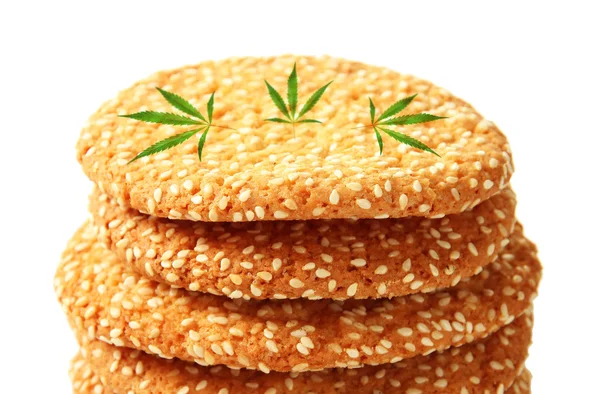 Tasty cookies with marijuana leaves on white background, closeup — Stock Photo, Image