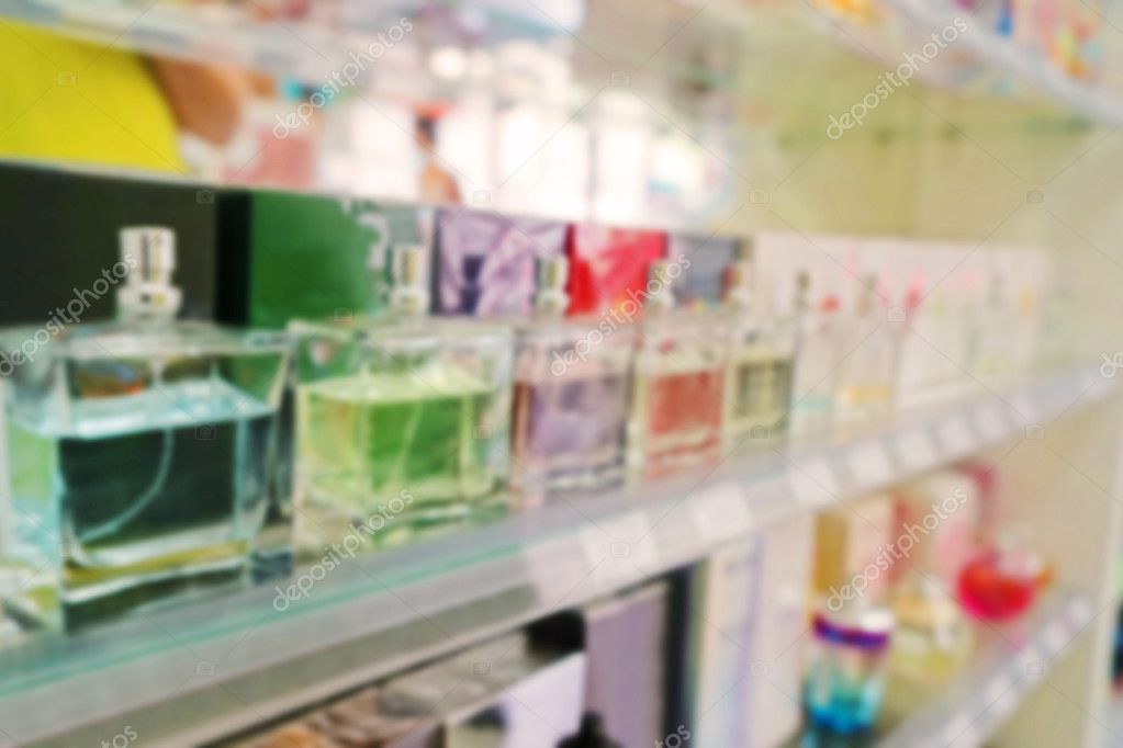 Perfume bottles on shelves — Stock Photo © belchonock 125163692